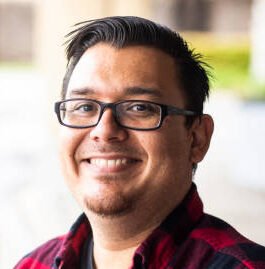 A portrait of a young man outdoors